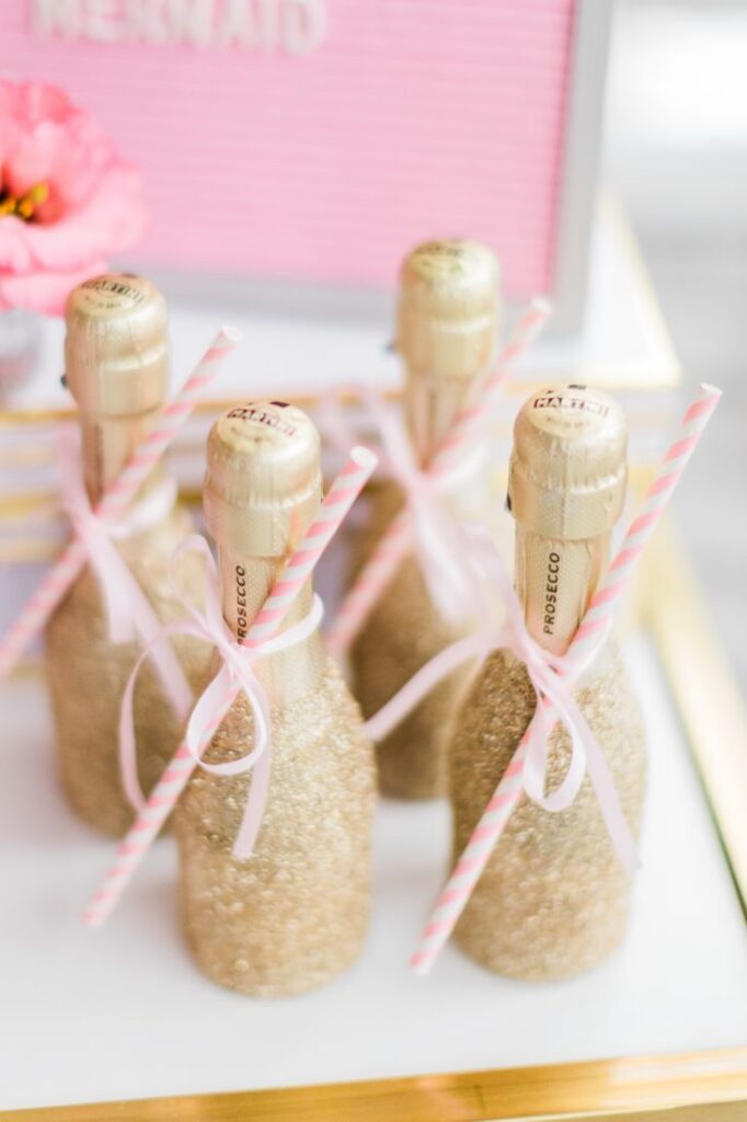 Galentines party idea mini glitter Champagne bottles