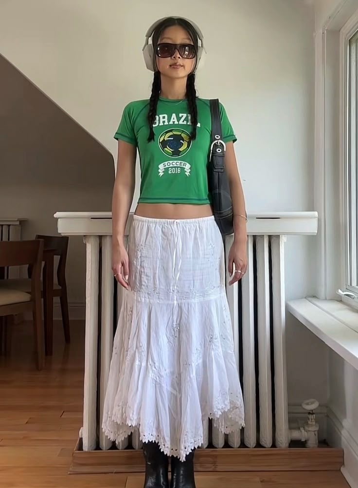 casual low rise maxi skirt styled with a green cropped tee and a black shoulder bag - summer outfits